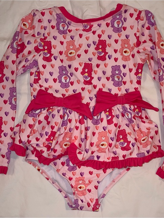 Ruffle Butts Other - Ruffle Butts X Care Bears 1 piece swimsuit/rashguard sz 4T NWT